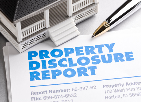 Property Disclosure Report with house and pen. ++All numbers and text is fictitious++