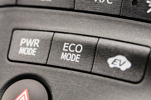 Power mode, Eco mode, and Electric Vehicle (EV) mode buttons on an electric hybrid car.