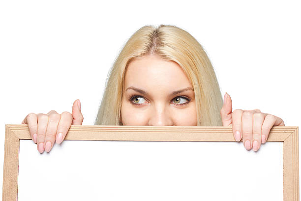istock Woman holding white blank board 175407644