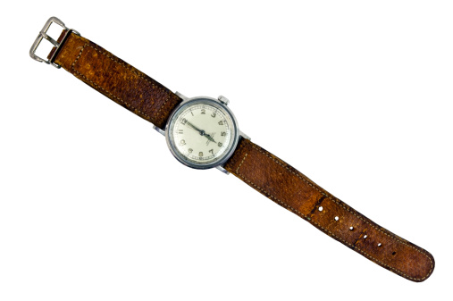 Vintage Swiss wristwatch with brown leather band on white background. Horizontal.