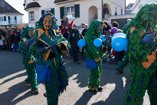 Oberkirch, Germany - February 12, 2023: Traditional carnival parade with traditionell masks and costumes