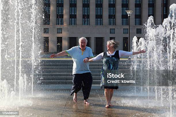 Mature Couple Dance In Fountains Stock Photo - Download Image Now - Fountain, Overweight, Dancing