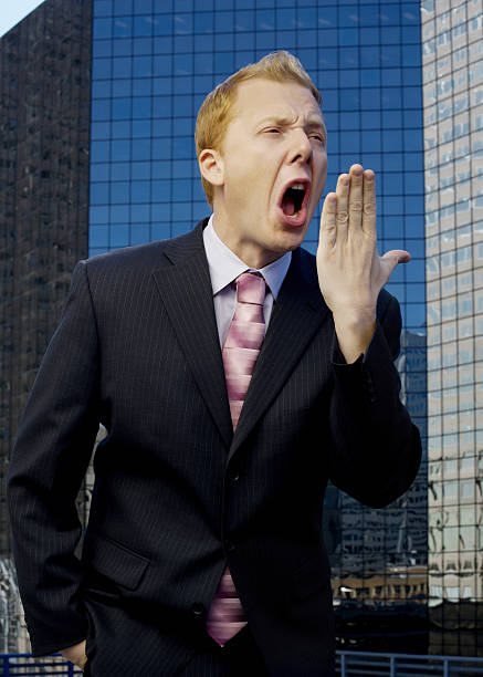 istock funny businessman yawns sarcastically on roof 175408576