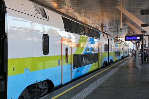 Trains stand on tracks at Wien Hauptbahnhof central railway station in Vienna Austria.