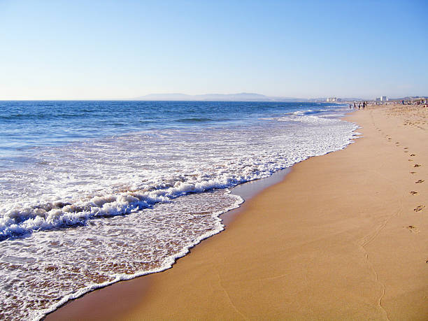 Wave reaching beach of Costa da Caparica (Portugal)