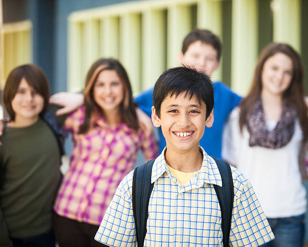 istock Young Boy Student with Friends in Background 175409351