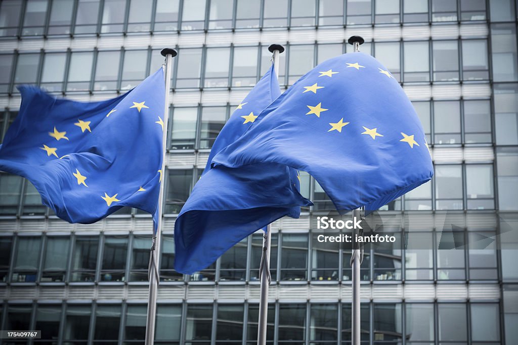 European flags. "European flags in front of the European Commission headquarters in Brussels, Belgium. ( Motion Blurred on flags)" European Union Stock Photo