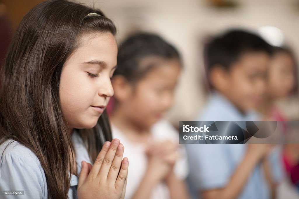 Children's religious program Children in a religious program Praying Stock Photo