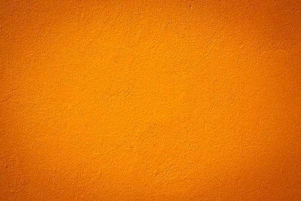 Photo of Light orange color wall texture