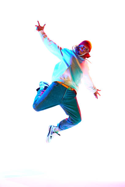 Happy woman with microphone jumping and singing