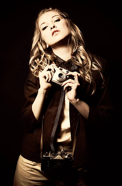 istock Fashion model with old cameras 175410005