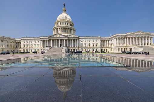 Washington DC, United States - July 26, 2023: US Capitol Building with reflection in one of the Skylight Reflecting Pools