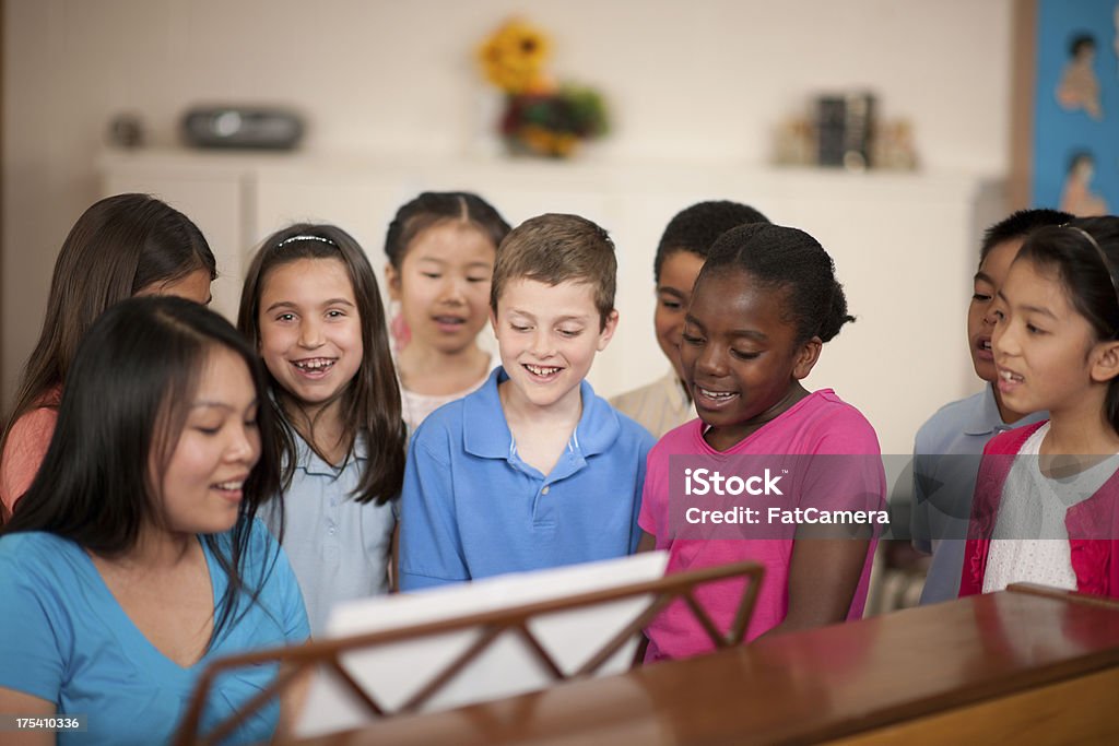 Children's religious program Children's choir singing together. Child Stock Photo