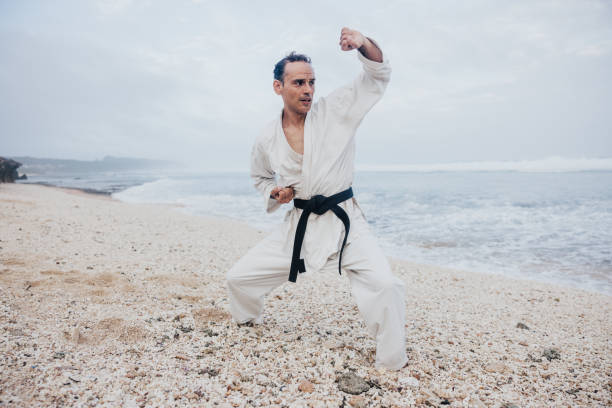 istock Man improving his karate skills at the beach 1754103433