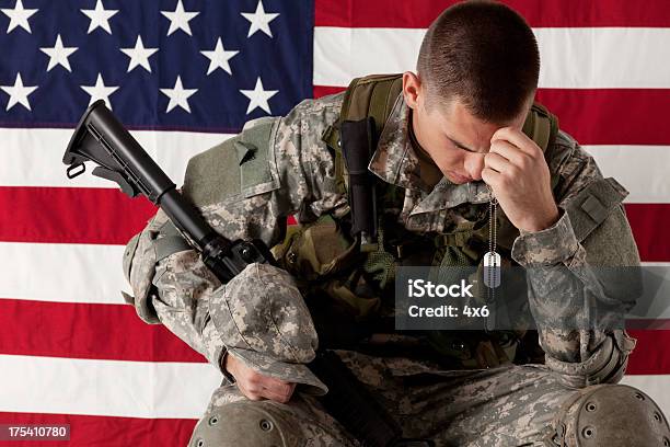 Army Soldier Sitting In Front Of American Flag Stock Photo - Download Image Now - Army Soldier, Armed Forces, Sadness