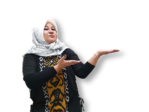Indonesian Muslim woman in hijab, posing with hands raised, showing empty space for promotional advertising.Isolated on white background