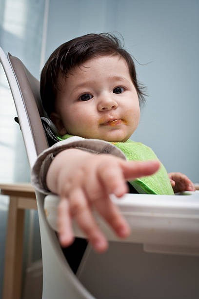 istock Baby in a High Chair 175411681