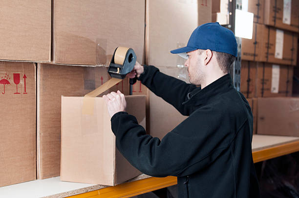 Wrapping a cardboard box with duct tape