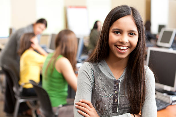 istock Happy young girl in the school computer lab 175412031