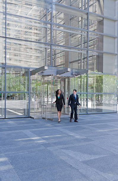 istock Business people exiting through a pair of doors 175412092
