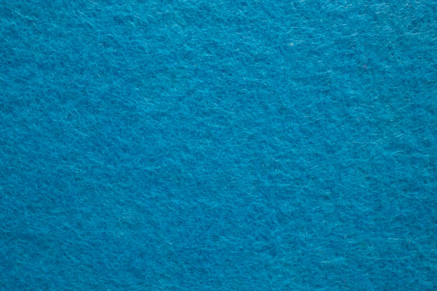 istock Felt fabric texture with visible fiber, blue color abstract pattern backdrop, 1754124140