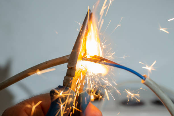 istock flame and sparks with pliers cutting  electrical cables, fire hazard concept, soft focus close up 1754124934