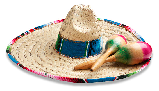 Colorful maracas and sombrero hat isolated on white. Musical instrument