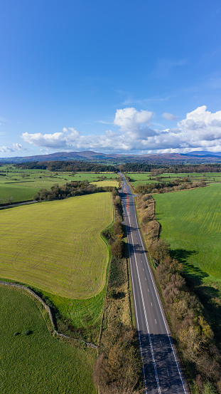 Aerial view from a drone of the A75 main road in a rural location in Dumfries and Galloway Scotland