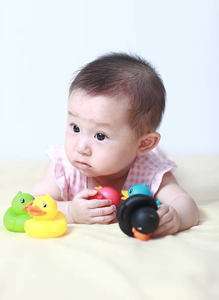 istock Cute asia baby on the bed 175413549
