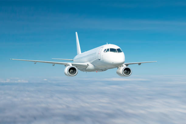 istock Modern white passenger airliner fly in the sky above the clouds 1754140538