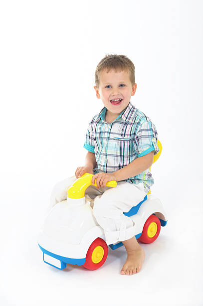 adorable 2 year old boy plays and has fun on the slide