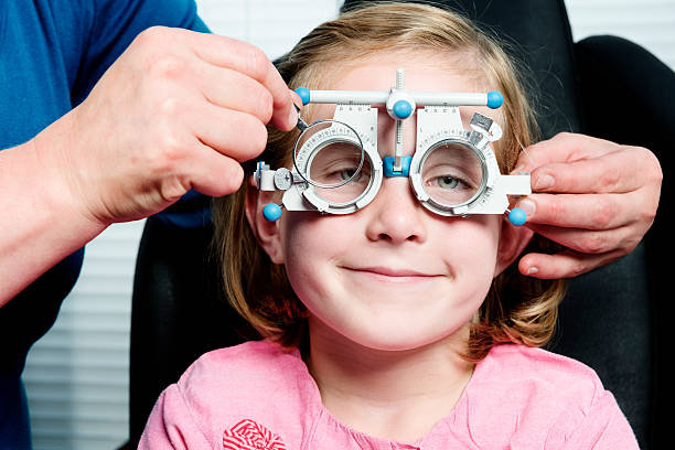 istock Young Girl Having Her Eyesight Checked 175414383