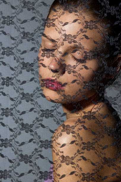 istock Young Woman behind fabric 175414462
