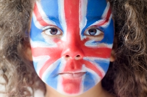 Royalty free stock photo of five years old girl with Union Jack face painted.This file has