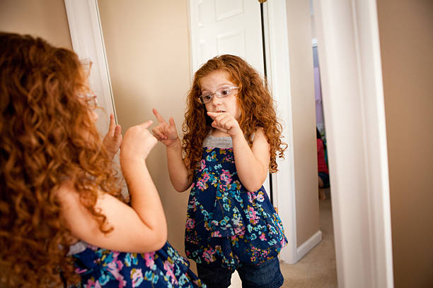 istock Little Girl With Attitude Talking To Herself in Mirror 175414861