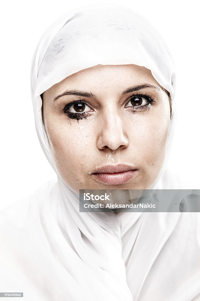 Tears of a Muslim woman Sweat and tears of a young Muslim woman Embarrassment Stock Photo