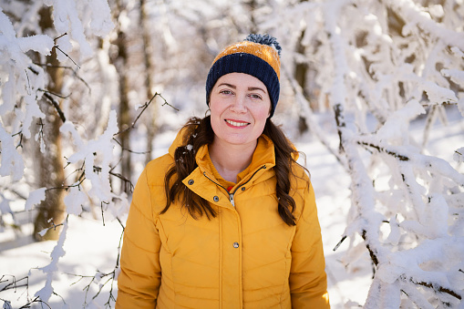 Portrait of a woman in the snowy forest.