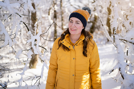 Portrait of a woman in the snowy forest.