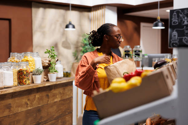 istock Lady browsing in a bio grocery store 1754154438