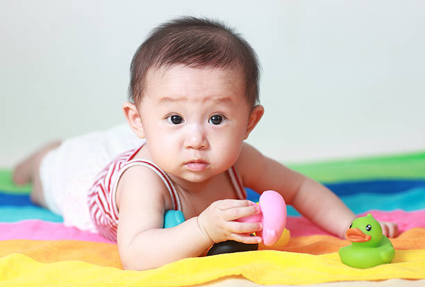 istock Cute asia baby on the bed 175415490