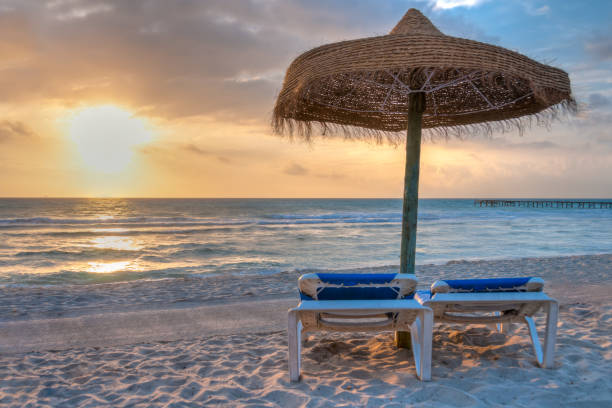 Luxury beach with white sand and blue water.