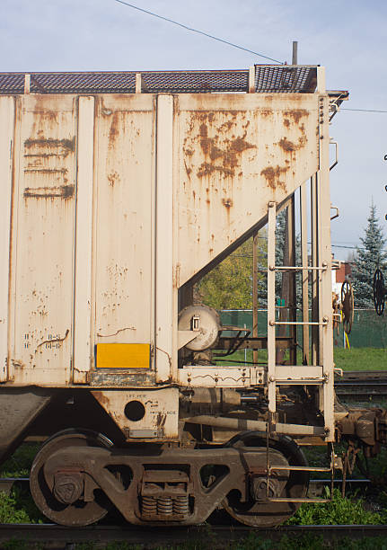 istock Detail of Rusty Hopper Railway Car on Siding 175415699
