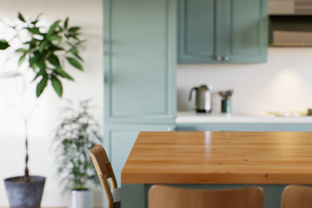 istock Green kitchen with wood countertops and accent island for product display. Empty kitchen countertop with blurred kitchen background with appliances and utensils. 3D rendering. 1754157805