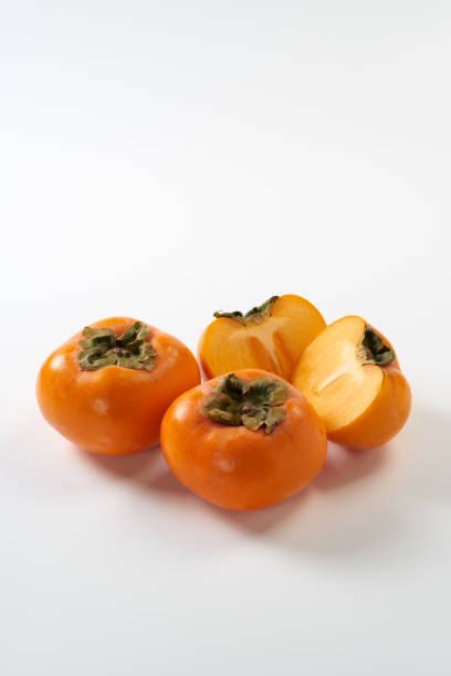 istock Japanese persimmons with white background 1754157827
