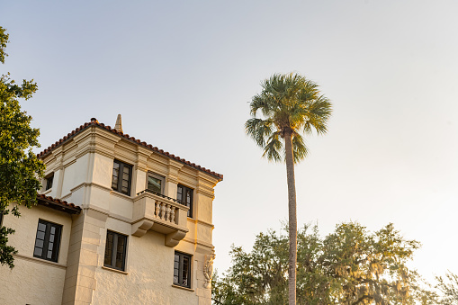 In Winter Park, the sun shines down on  a historic building in the downtown Rollins College Campus.
