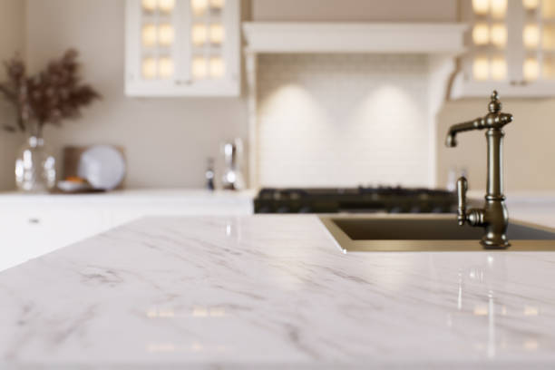 istock Kitchen with marble countertops and blurred kitchen background to display products on the surface. Kitchen interior with household appliances and utensils. 3D rendering 1754159737