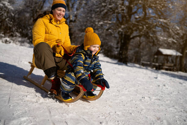 istock Mom and son enjoying the sleigh ride 1754160687