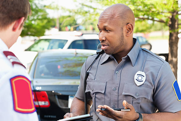 istock Police officer interogating people at an emergency scene 175416328