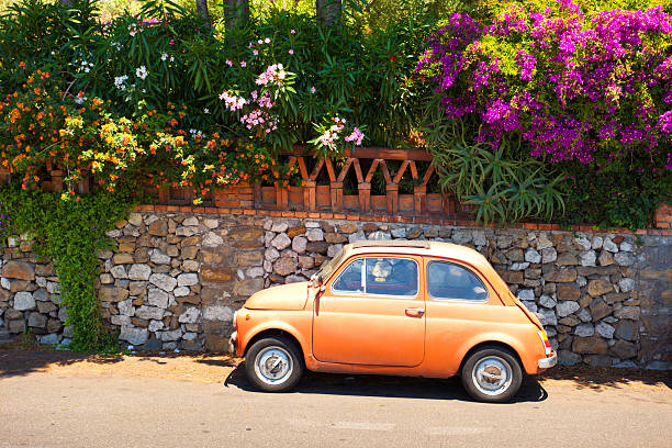 morning of taormina and lovely tiny italian car - sicilië stockfoto's en -beelden