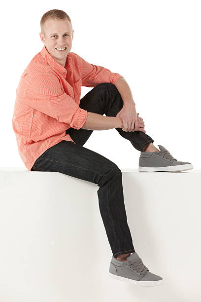 istock Man sitting on the ledge of a wall 175416510